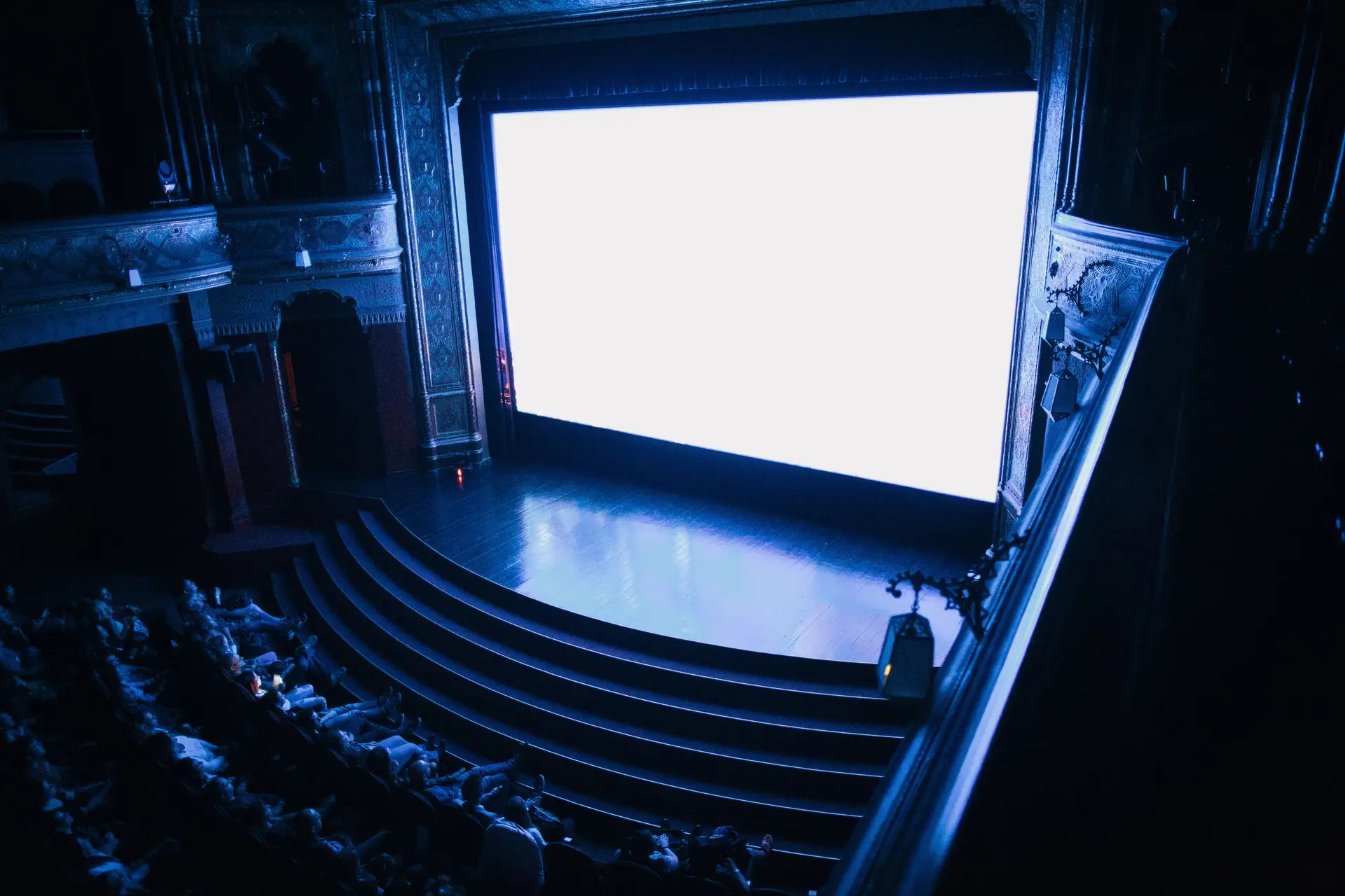 Cinematic view of a grand theatre stage with atmospheric lighting